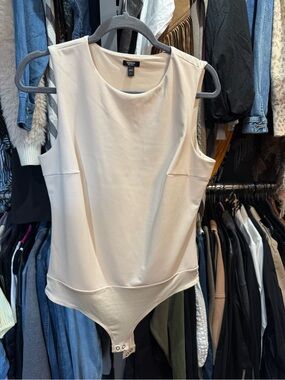 Express Cream Sleeveless Bodysuit
Faux leather